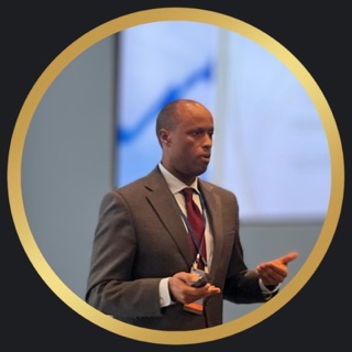 Joe Rubagumya speaking at a professional event